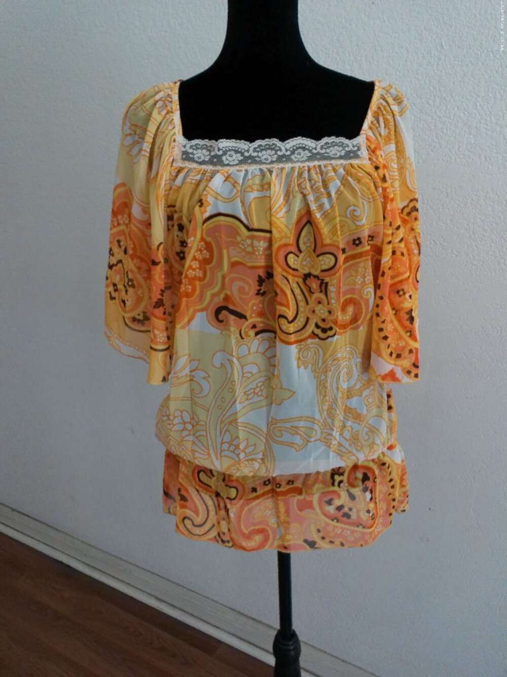 Love Squared, Yellow and orange floral replum top with lace design